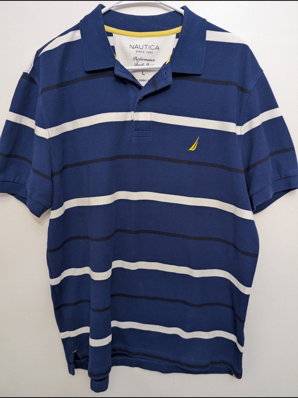 Nautica Navy Blue Polo with White Stripes and Yellow Sail Logo